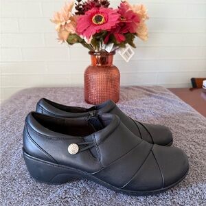 Clarks Black Women's Mules with Button Detail